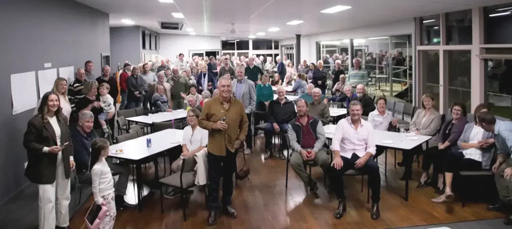 A large group of 150 people (family and friends) gathered indoors at Damien Harrington's retirement party, hosted by AWN Wimmera Livestock and Property.