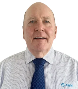 A professional headshot of an AWN wool specialist wearing a blue AWN diamond tie and white striped shirt. 